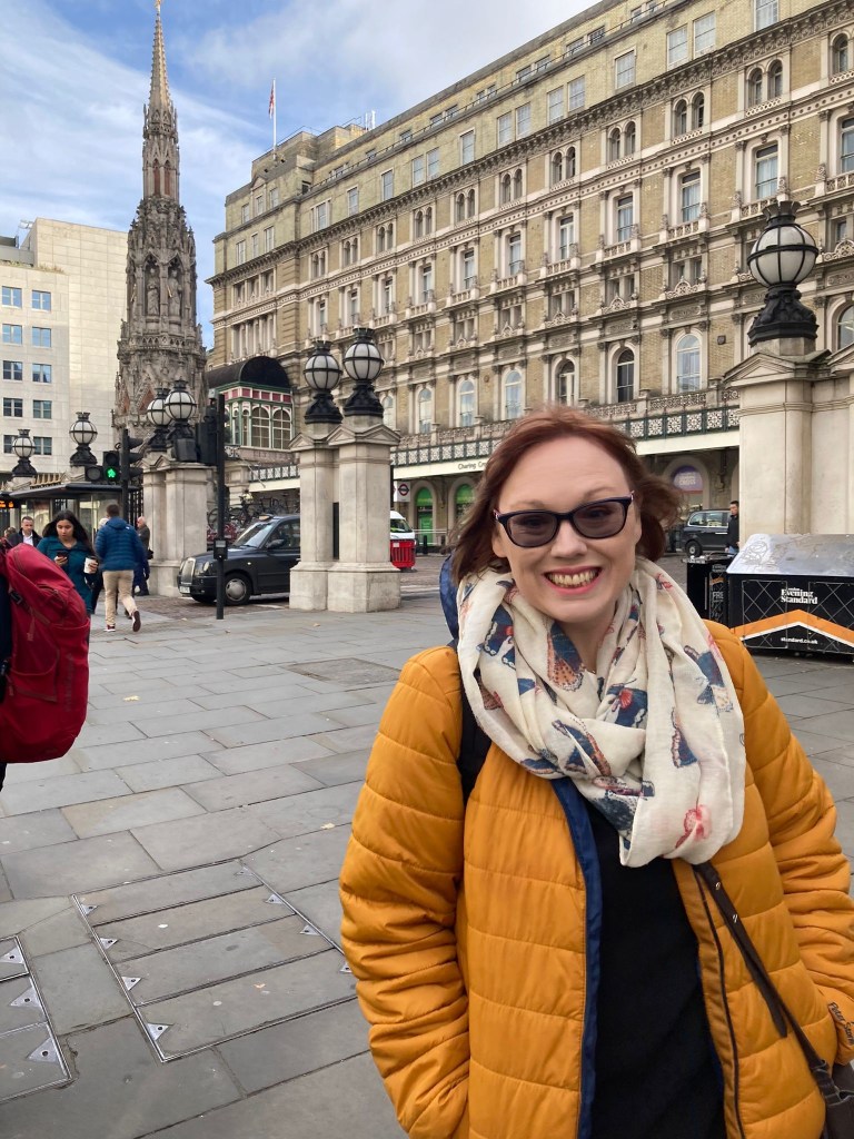 Natalie Hicks a woman with glasses standing outside Charing Cross train station London